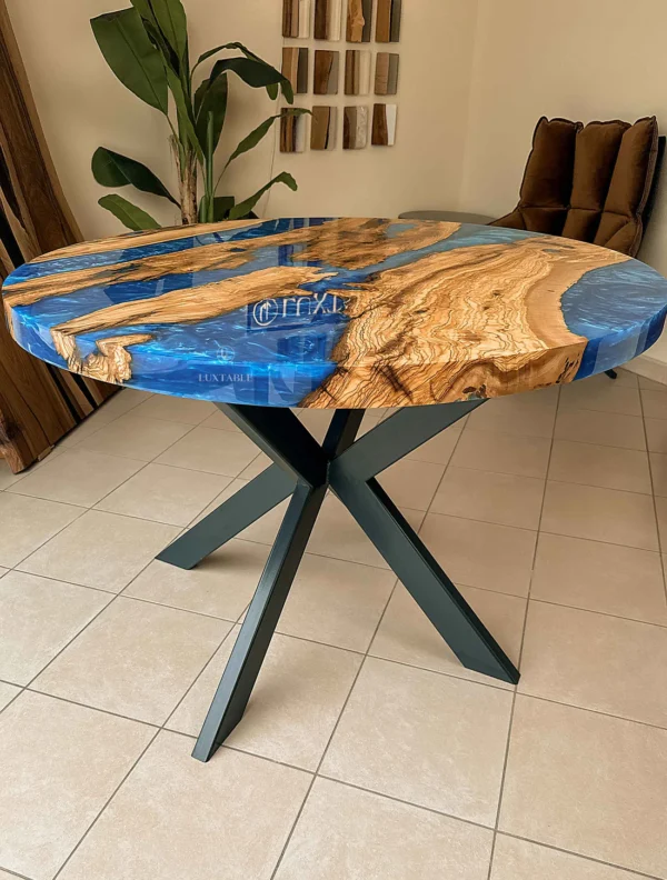 Round olive wood resin dining table Oceanic with solid olive wood, blue and azure ocean-inspired epoxy resin, and matte anthracite metal base