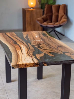 Blue gold walnut epoxy dining table Maleficenta with solid walnut wood, blue resin with gold accents, and matte black metal legs